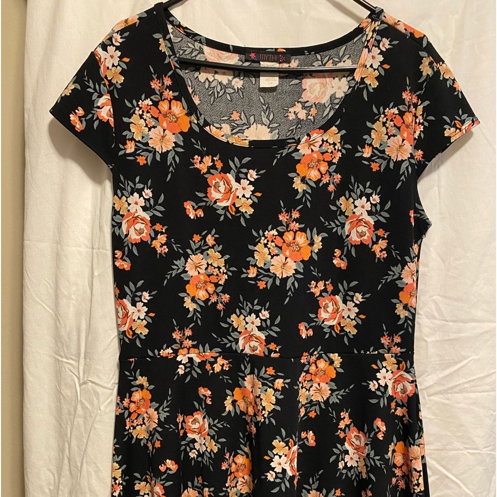 Black flowered, cap sleeve, knee length dress by Myth.